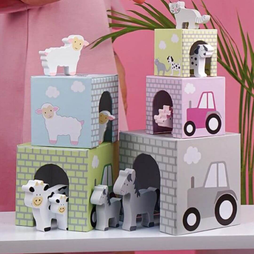 Set of stackable farm animal blocks by Jabadabado, ideal for imaginative play.
